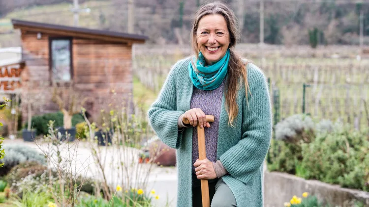 Woman gardening in warm winter clothes